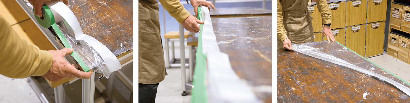 マスカーテープで机を養生している様子　