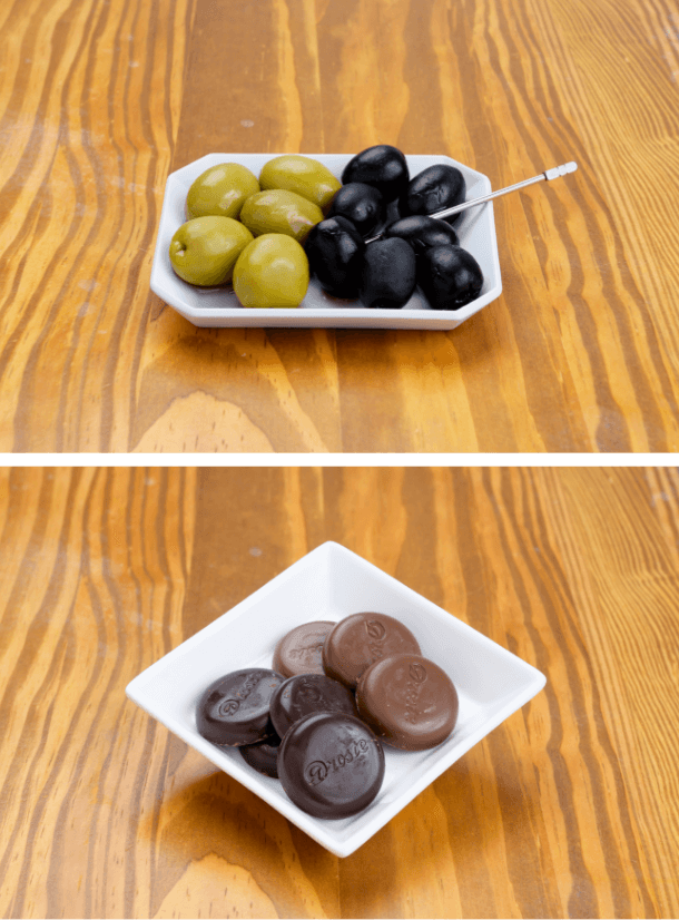 お皿に盛られたオリーブとチョコレート
